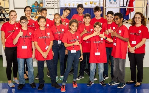 Maple Leaf International School Robo Pack team members, coaches and supporters pose for a photo